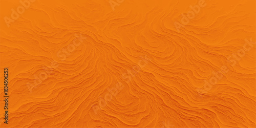 The natural texture of the dry orange and brown sand on the beach creates a wave pattern like a desert dune for a striking background