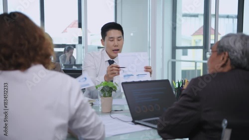 Business concept of 4k Resolution. Asian business professionals are discussing a deal in the meeting room.