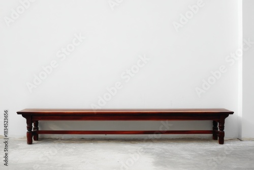 Wooden Bench Against White Wall