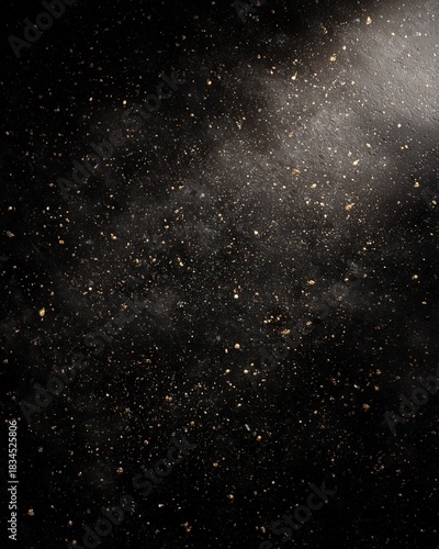Abstract black background with gold glitter particles