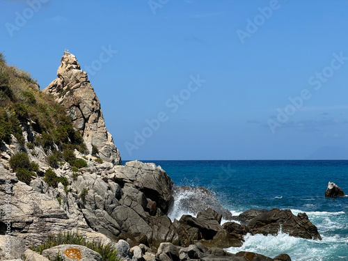 Calabria, Italy, beach and surf among rocks, Mediterranean