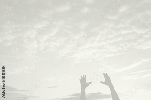 Male hands silhouette under sky, Cloud Dancer trend, color of year 2026