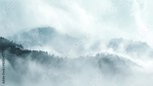 Fog covers mountains and trees during early morning in a quiet rural area. Cloud dancer trend color 2026