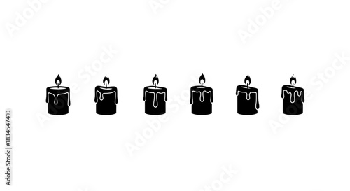 Set of six black candles with burning flames