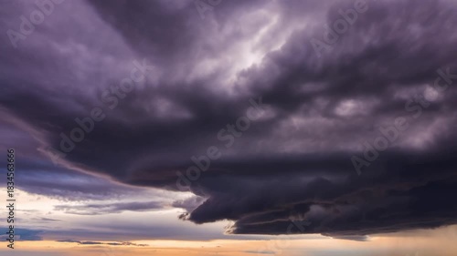 A dramatic view of dark storm clouds rolling across the sky, foreshadowing an approaching tempest. The sky is filled with swirling shades of gray and purple, creating a sense of awe Stock Video