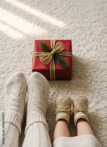 Cozy Christmas Morning Feet, Gift, and Festive Cheer on a Soft, Creamy White Carpet with Sunlight