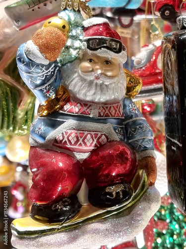 Christmas glass decorations for sale on a shop window, decorative hand painted ornament for the christmas tree