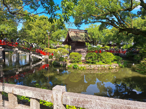 Traditional Red Bridge and Pond Garden at Dazaifu Tenmangu Shrine, Fukuoka, Japan