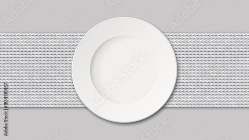 Top view of empty dish placed on a white fabric placemat on a cement counter background