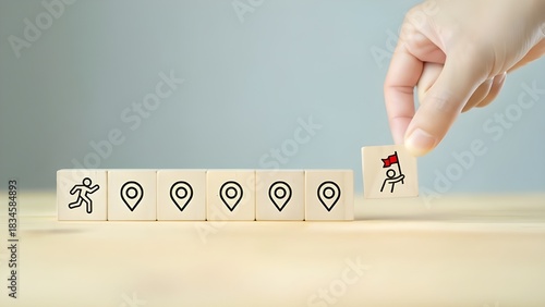 Hand arranging wooden blocks with runner and flag icons for goals and achievement concept isolated PNG with Transparent Background