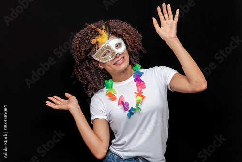 Young woman at carnival party with decorated mask