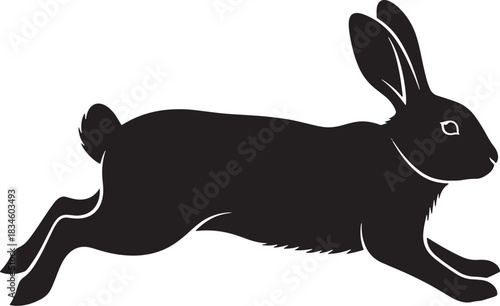 Black rabbit silhouette lying down, isolated side view on white.