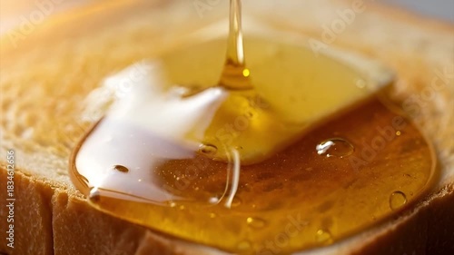 Close-Up Honey Dripping onto Toast in Warm Morning Light