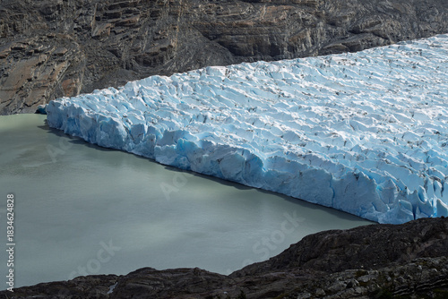 Massive blue terminal face of Grey Glacier meeting glacial lake, Chile