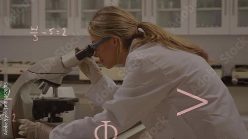 Lab scientist peering into microscope and adjusting knobs while math notes appearing, showing data