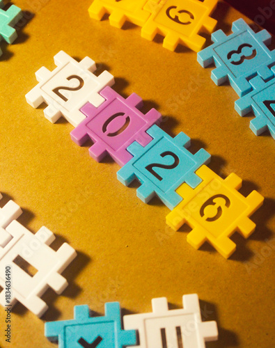 Colorful plastic number blocks arranged to form “2026,” creating a playful and bright New Year theme. Perfect for holiday greetings, education materials, and festive promotional designs.