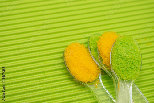 Green and yellow lemon salt on natural background