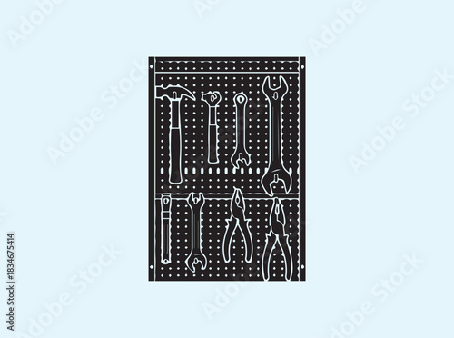 Solid black workshop pegboard silhouette with assorted tools displayed in tidy formation
