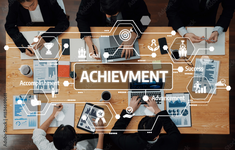 Obraz premium A diverse team engages in a productive meeting centered on achievement and strategic goals, surrounded by charts and data for business growth and success. Amity