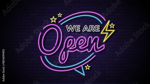 A neon sign reading we are open. Glowing neon sign declaring business is open, ideal for advertising signs, storefronts, and business marketing displays.