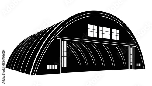 Large Quonset hut structure with windows and large open doors, symbolizing industrial or agricultural use