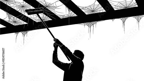 Man Cleaning Cobwebs From Ceiling with a Long Brush