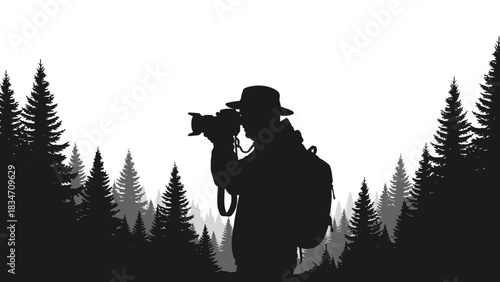 A silhouette of a photographer wearing a hat and backpack, taking pictures in a forest of pine trees.