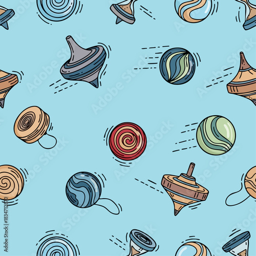 Colorful spinning tops and marbles pattern on light blue background.