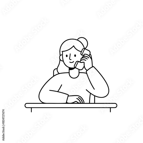 A woman is working on a computer at a desk in a simple office environment, viewed from the front.