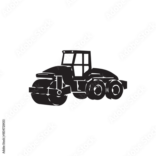 Silhouette of a heavy road roller construction vehicle