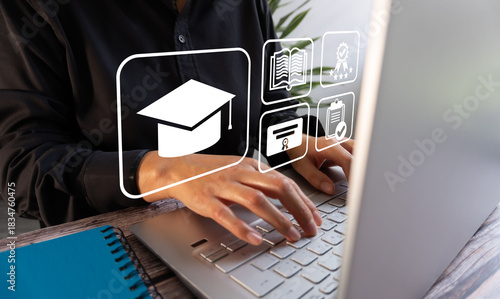 A person types on a laptop with virtual icons of a graduation cap, books, approval, and certificates. E-learning concept