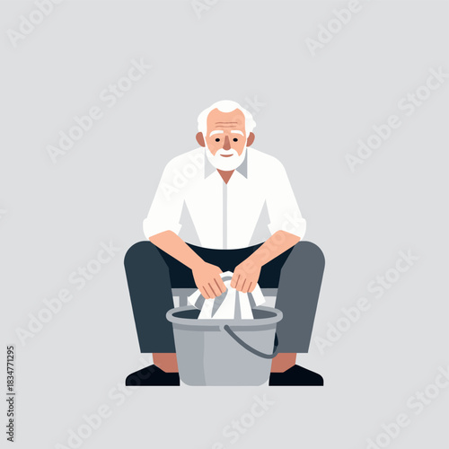 An elderly man is sitting and washing clothes in a bucket, engaged in manual laundry work.