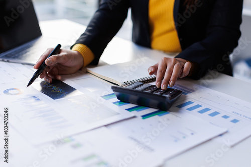 Accounting company provide finance and taxation planning for profitable cash flow, Auditor accountant working in office, analyze financial data and accounting record with calculator.Insight.