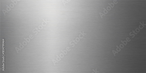 Polished stainless steel plate with a brushed metal texture featuring a shiny silver metallic surface and industrial chrome reflection for a gray aluminum wallpaper backdrop