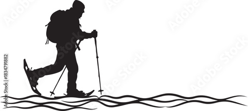 Snowshoer hiker silhouette walking in snow