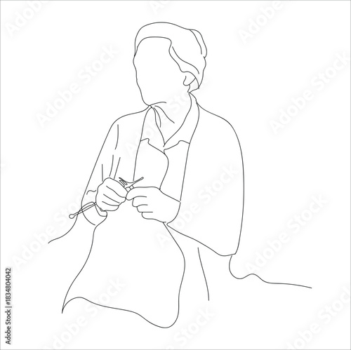 woman embroidering cloth. A woman embroiders on fabric