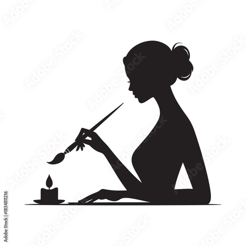 Silhouette of a woman painting by candlelight