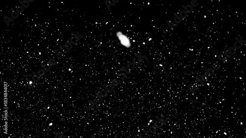 snow falling on black background