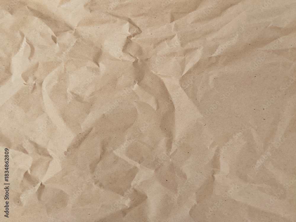 Obraz premium Abstract brown crumpled paper texture background