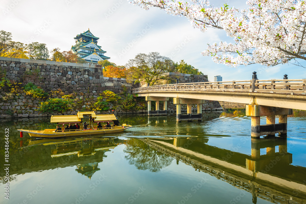 Naklejka premium A tourist boat in the moat of Osaka castle in Osaka, Kinki, Japan