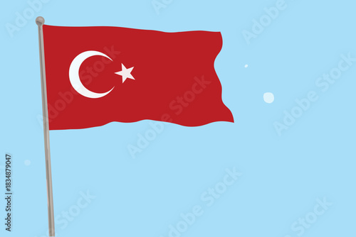 A vibrant red turkish flag waves proudly against a backdrop of pale