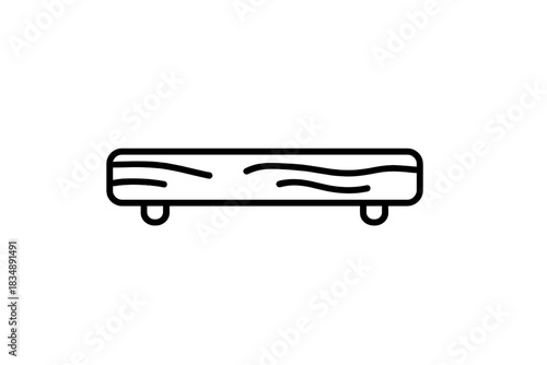Wooden cutting board or serving platter with small legs used for kitchen food preparation