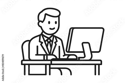Smiling professional businessman sitting at desk working on computer