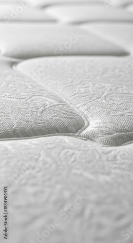 Close-up perspective showcasing the pristine white mattress surface details and texture
