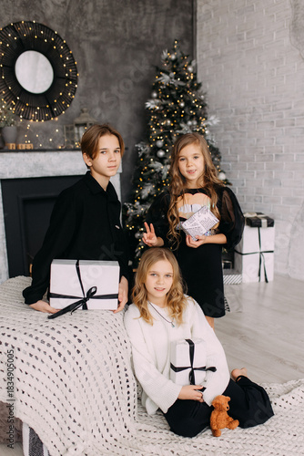 photo shoot in the studio family children brothers and sisters photo together love joy friendship new year mood decor festive