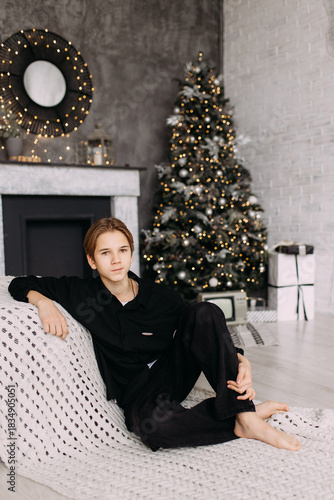 New Year's photo in the studio boy child teenager New Year's mood interior