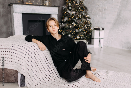 New Year's photo in the studio boy child teenager New Year's mood interior