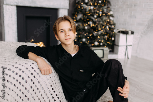 New Year's photo in the studio boy child teenager New Year's mood interior