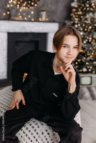 New Year's photo in the studio boy child teenager New Year's mood interior
