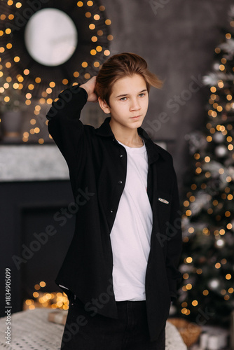 New Year's photo in the studio boy child teenager New Year's mood interior